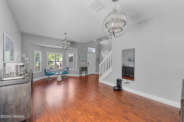 interior space with hardwood / wood-style floors and a notable chandelier