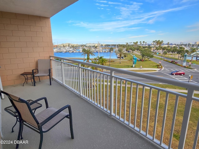 balcony featuring a water view