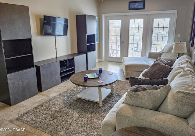 living room with tile patterned floors and french doors