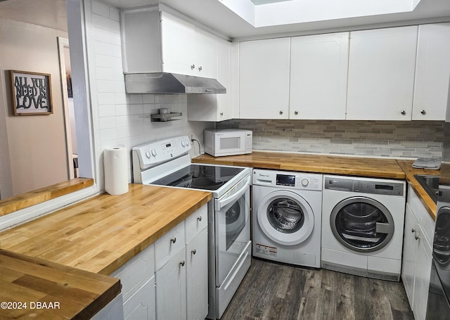 kitchen with white appliances, independent washer and dryer, range hood, dark hardwood / wood-style flooring, and white cabinetry