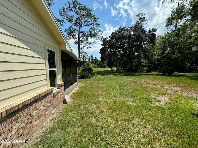 view of yard featuring a sunroom