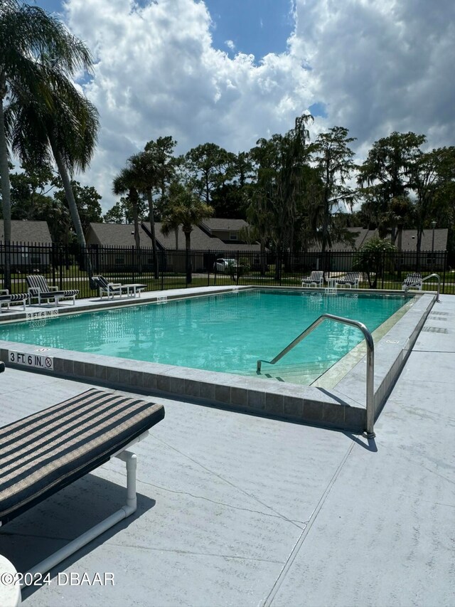 view of swimming pool featuring a patio area