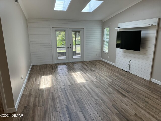 kitchen with french doors, white cabinets, sink, decorative backsplash, and ornamental molding