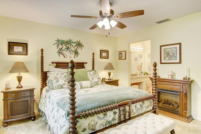 2051 Cornell Pl Unit 26, Port Orange, FL 32128 - bedroom featuring light carpet, ensuite bathroom, and a ceiling fan
