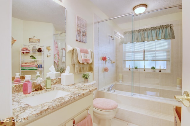 full bathroom featuring bath / shower combo with glass door, toilet, and vanity