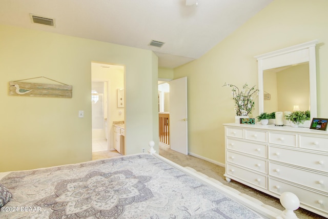 carpeted bedroom featuring ceiling fan and ensuite bath