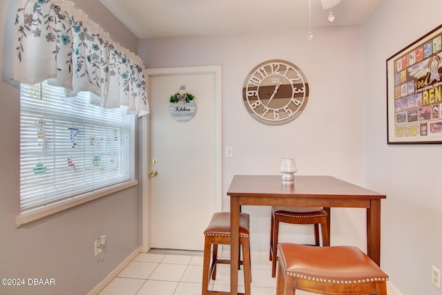 dining area featuring light tile patterned floors