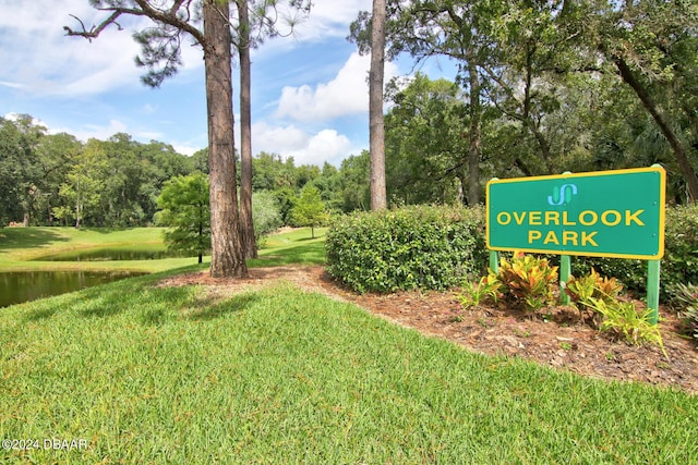 2051 Cornell Pl Unit 26, Port Orange, FL 32128 - view of community with a yard and a water view