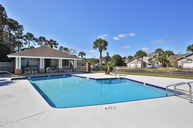 view of swimming pool featuring a patio area