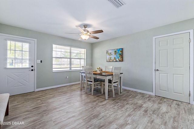 dining space featuring ceiling fan and light hardwood / wood-style flooring