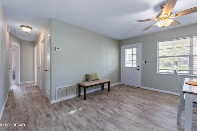 foyer featuring ceiling fan and light hardwood / wood-style flooring