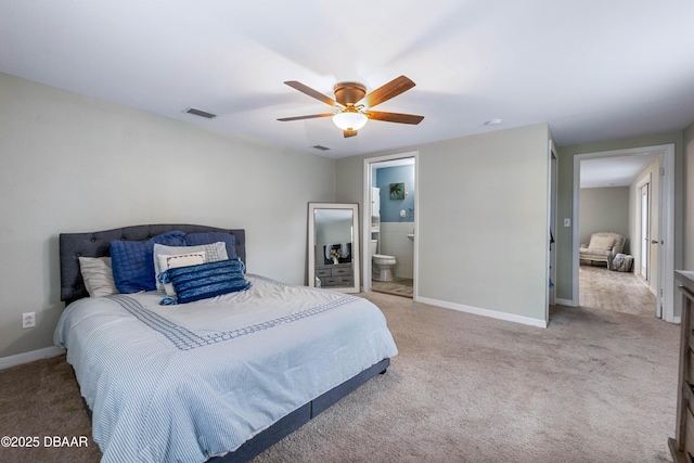 bedroom featuring ceiling fan, ensuite bath, and carpet