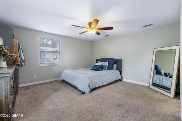 bedroom featuring light carpet and ceiling fan