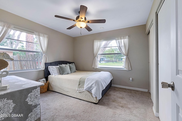 carpeted bedroom with ceiling fan