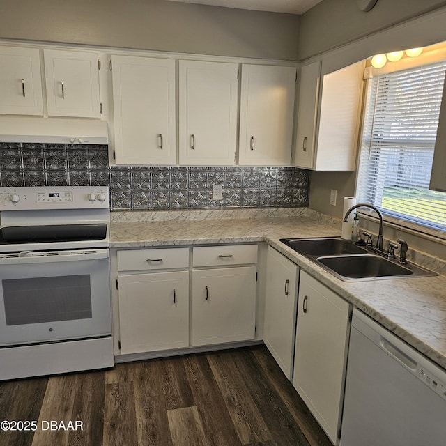 kitchen featuring dark wood-type flooring, white appliances, sink, and white cabinets