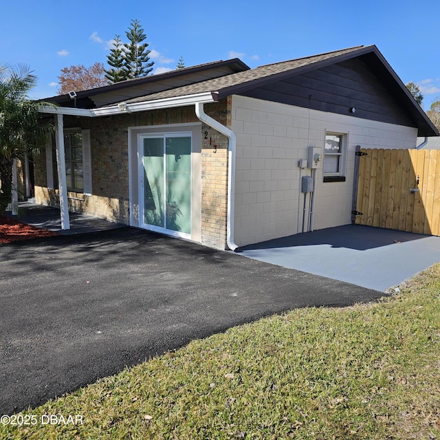 view of side of home featuring a patio area