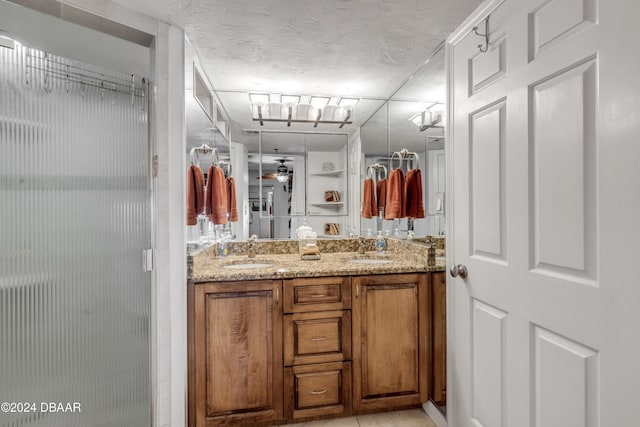 4141 S Atlantic Ave Unit 502, New Smyrna Beach, FL 32169 - bathroom featuring a stall shower and double vanity