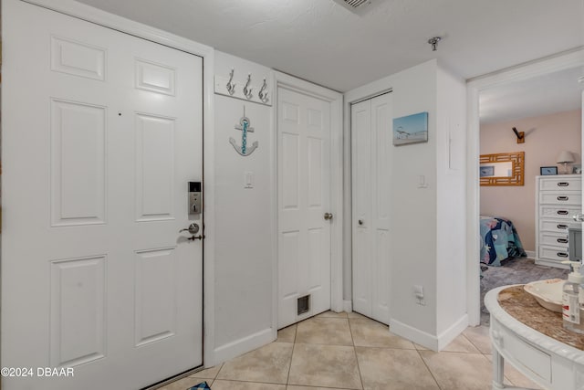 view of tiled foyer