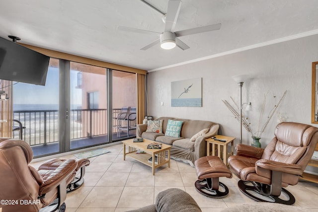 4141 S Atlantic Ave Unit 502, New Smyrna Beach, FL 32169 - living area with light tile patterned floors, ceiling fan, and crown molding