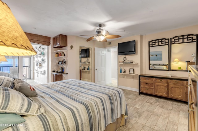 4141 S Atlantic Ave Unit 502, New Smyrna Beach, FL 32169 - bedroom featuring access to exterior, ceiling fan, baseboards, and light wood-style floors