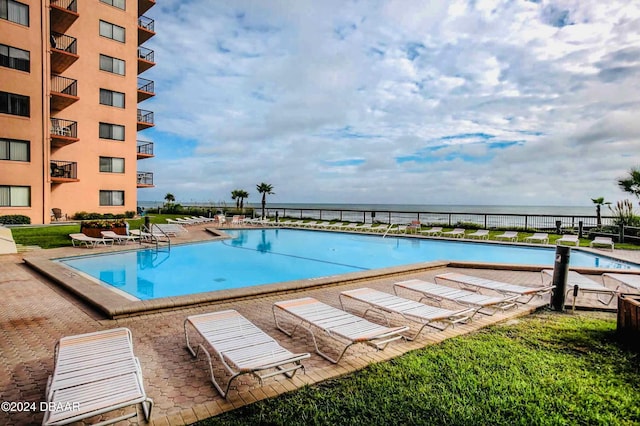 4141 S Atlantic Ave Unit 502, New Smyrna Beach, FL 32169 - community pool with a patio area and a water view