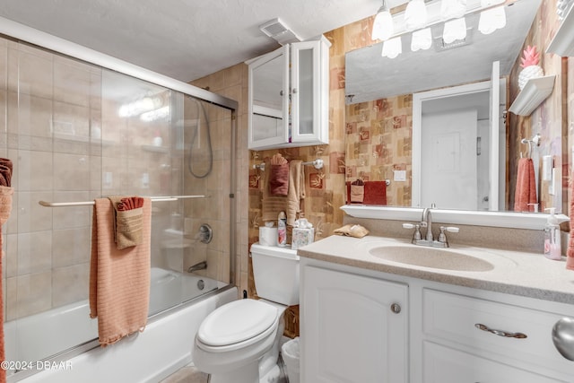 4141 S Atlantic Ave Unit 502, New Smyrna Beach, FL 32169 - bathroom with vanity, toilet, and combined bath / shower with glass door