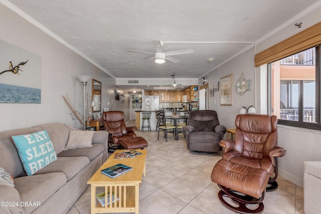 4141 S Atlantic Ave Unit 502, New Smyrna Beach, FL 32169 - living room featuring ceiling fan, light tile patterned floors, and crown molding