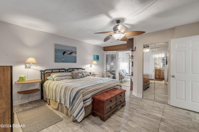 4141 S Atlantic Ave Unit 502, New Smyrna Beach, FL 32169 - bedroom featuring connected bathroom, a ceiling fan, baseboards, and light wood finished floors