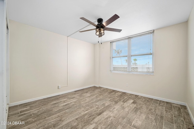 2800 N Atlantic Ave Unit 101, Daytona Beach, FL 32118 - unfurnished room featuring wood finished floors, ceiling fan, and baseboards