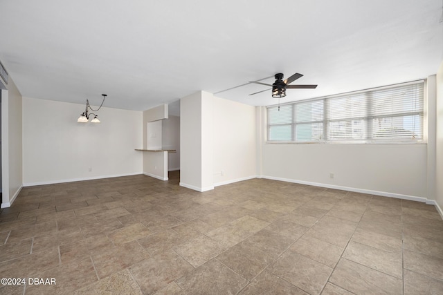 2800 N Atlantic Ave Unit 101, Daytona Beach, FL 32118 - spare room with a chandelier, a ceiling fan, and baseboards