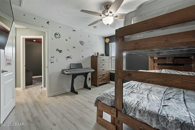 bedroom featuring light hardwood / wood-style floors and ceiling fan