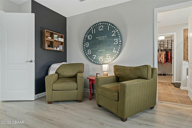 sitting room featuring light wood-type flooring