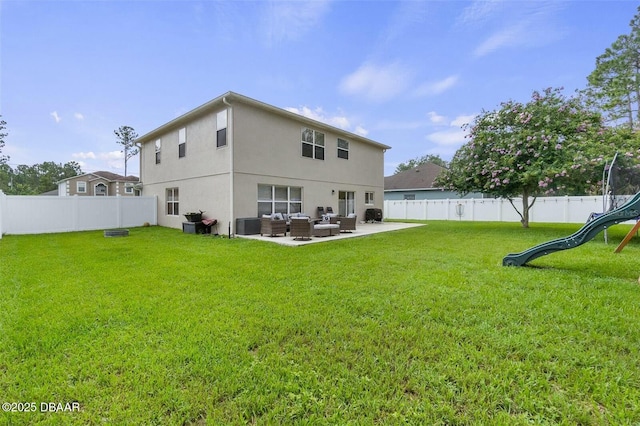 rear view of house featuring a yard, an outdoor hangout area, a playground, central AC unit, and a patio area