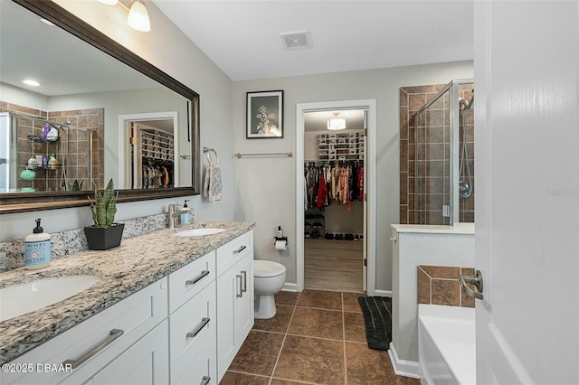 full bathroom with tile patterned flooring, vanity, toilet, and plus walk in shower