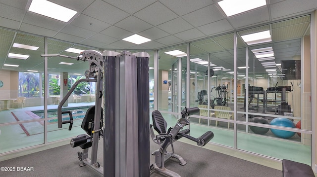 workout area featuring a drop ceiling