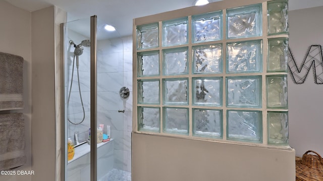 bathroom with tiled shower