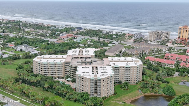 drone / aerial view with a water view and a beach view