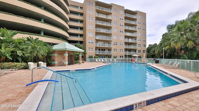 view of swimming pool with a patio