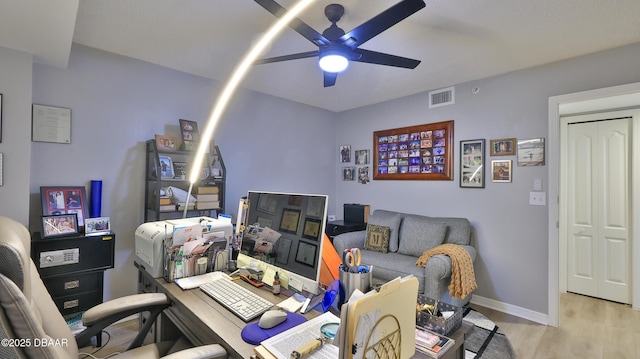 office space with ceiling fan and light hardwood / wood-style flooring