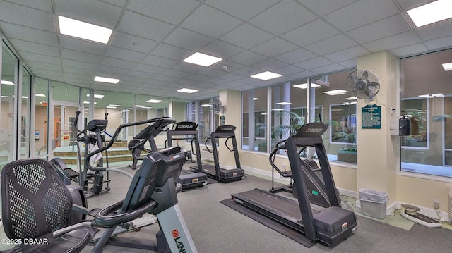 exercise room featuring a paneled ceiling