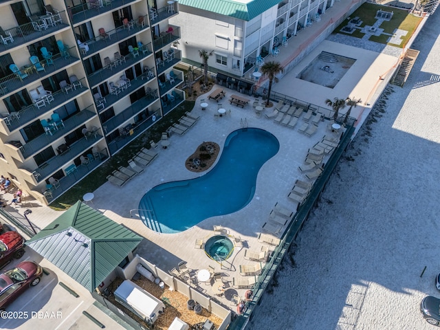 view of pool with a community hot tub and a patio area