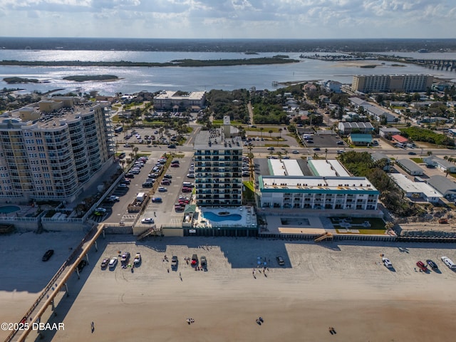 bird's eye view with a water view and a view of the beach