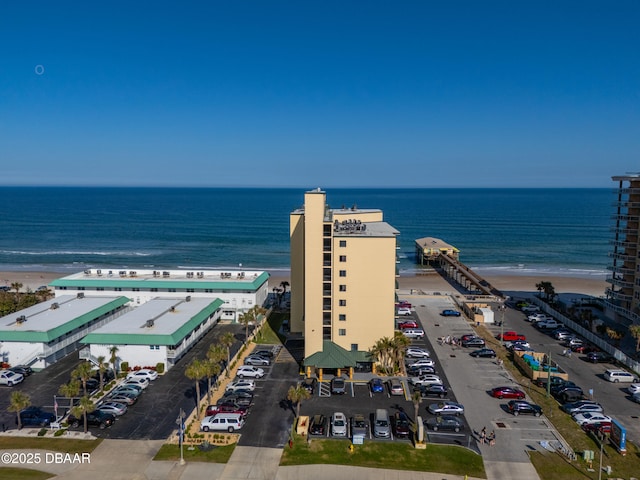 aerial view featuring a water view and a beach view