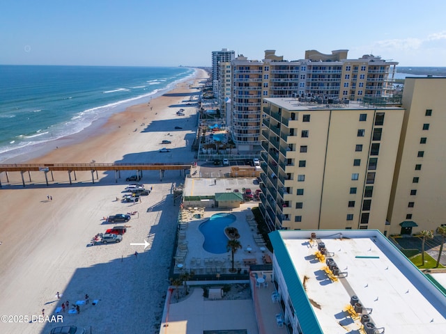 birds eye view of property featuring a view of the beach and a water view