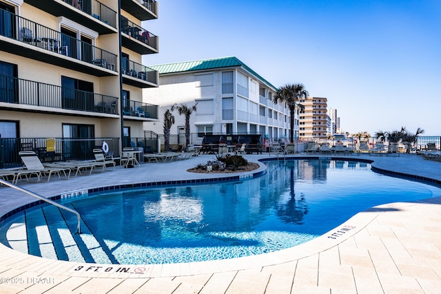 view of pool featuring a patio