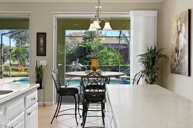 dining space featuring light tile patterned flooring