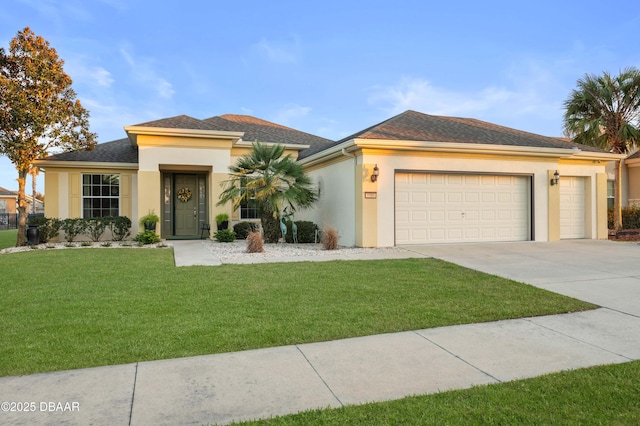 view of front facade with a garage and a front yard