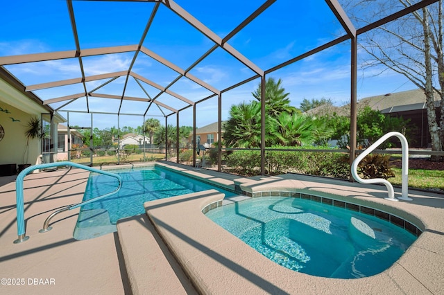 view of pool with an in ground hot tub and glass enclosure