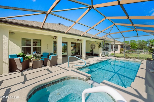 view of swimming pool featuring an outdoor living space, ceiling fan, an in ground hot tub, and glass enclosure