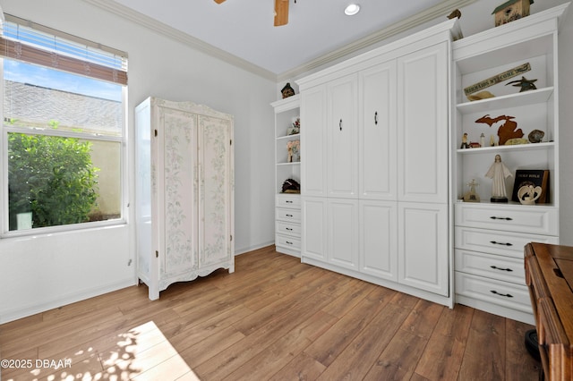 bedroom with crown molding, a closet, ceiling fan, and light hardwood / wood-style flooring